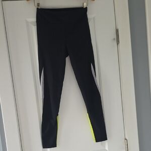 ALALA Black Leggings with Vibrant Neon Yellow Leg Details